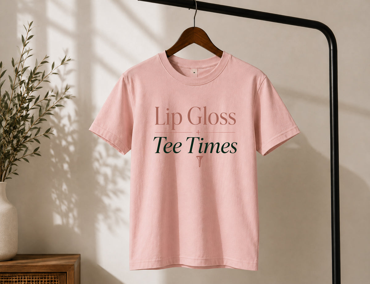 Lip Gloss & Tee Times women's golf graphic tee displayed on hanger