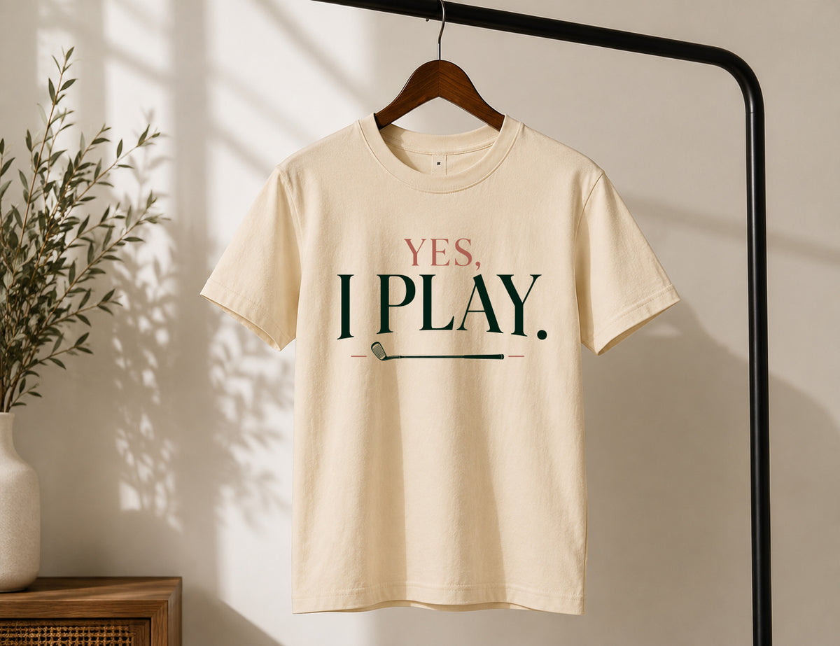 Yes. I Play. women's golf graphic tee displayed on wooden hanger